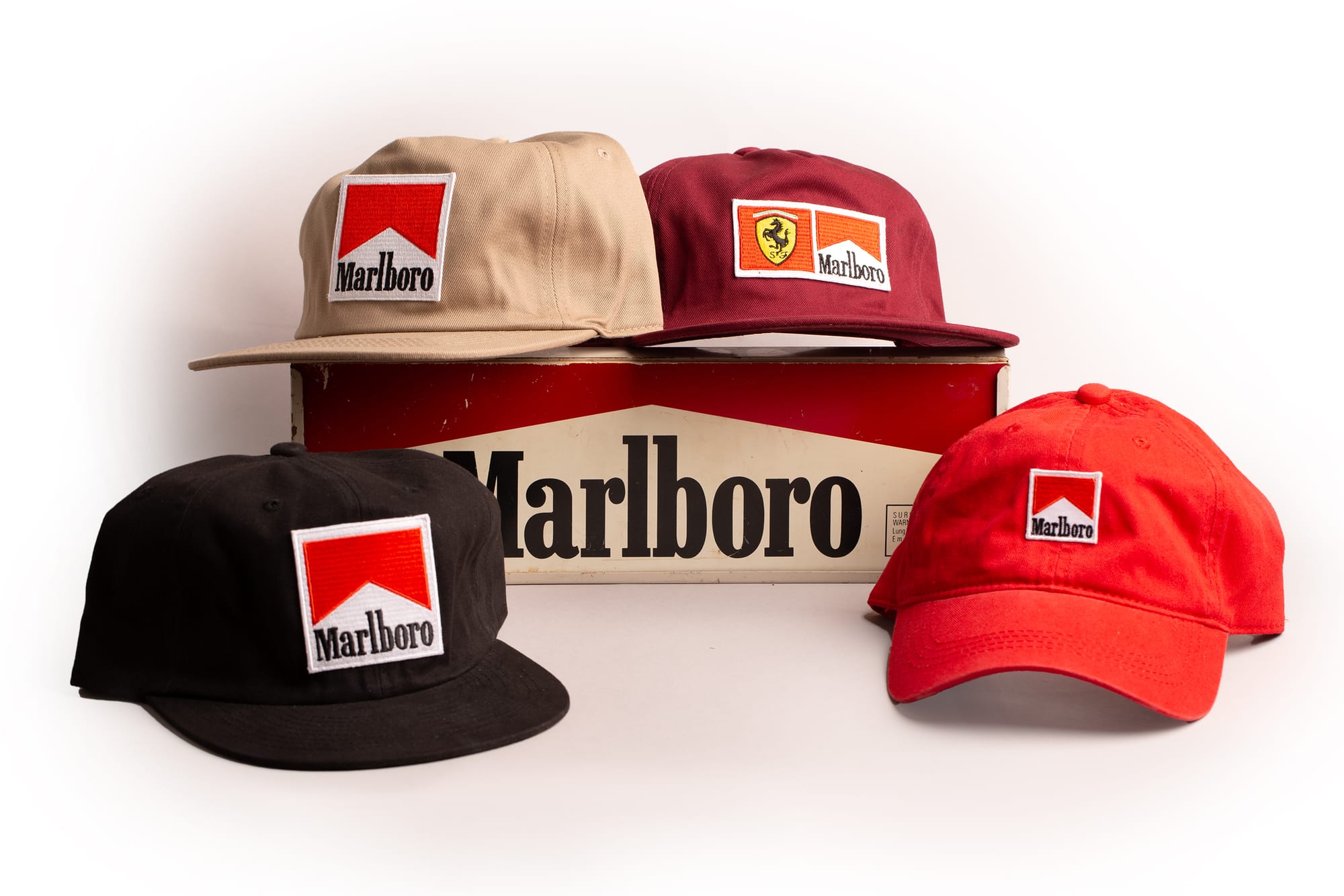 Marlboro vintage patch caps on a marlboro tin sign